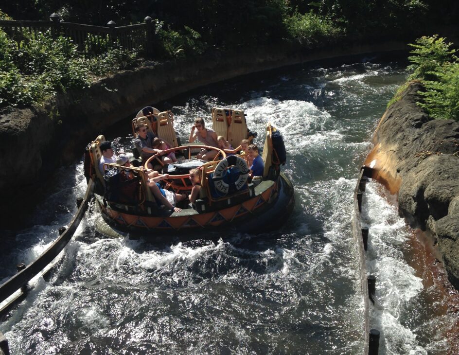 Guests riding Kali River Rapids water attraction Disney World
